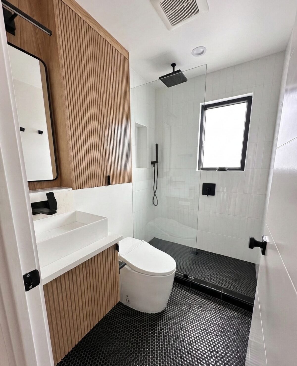 Primary finished-room view of white oak bathroom vanity cabinetry and surrounding surfaces