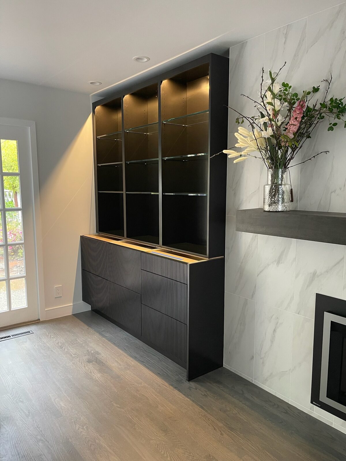Primary finished-room view of three-tone with fluted doors cabinetry and surrounding surfaces