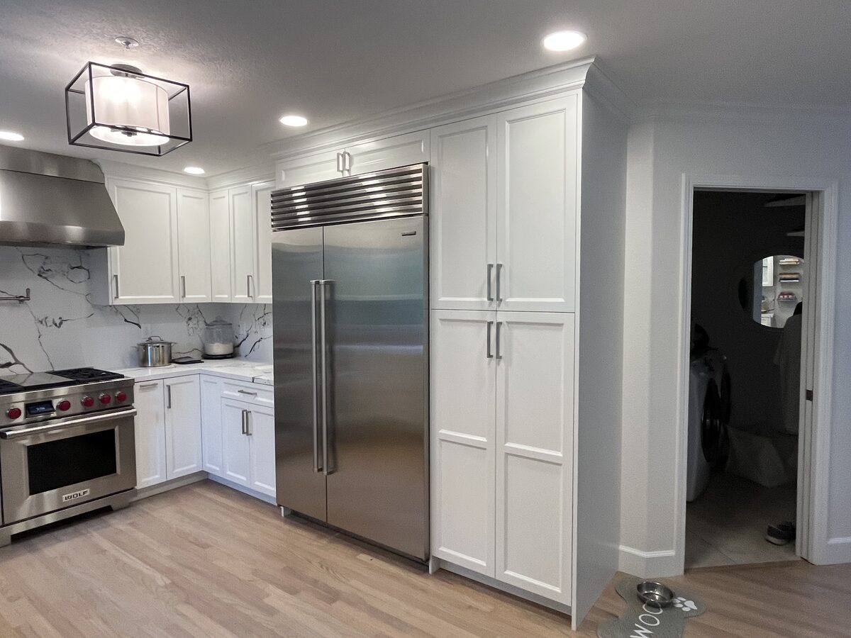 Primary finished-room view of white dove kitchen cabinetry and surrounding surfaces