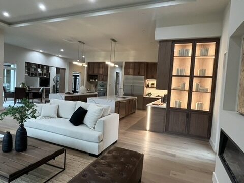 Primary finished-room view of walnut open-plan kitchen cabinetry and surrounding surfaces