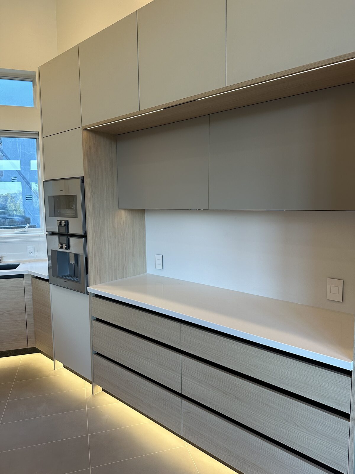 Primary finished-room view of white oak with espresso center cabinetry and surrounding surfaces